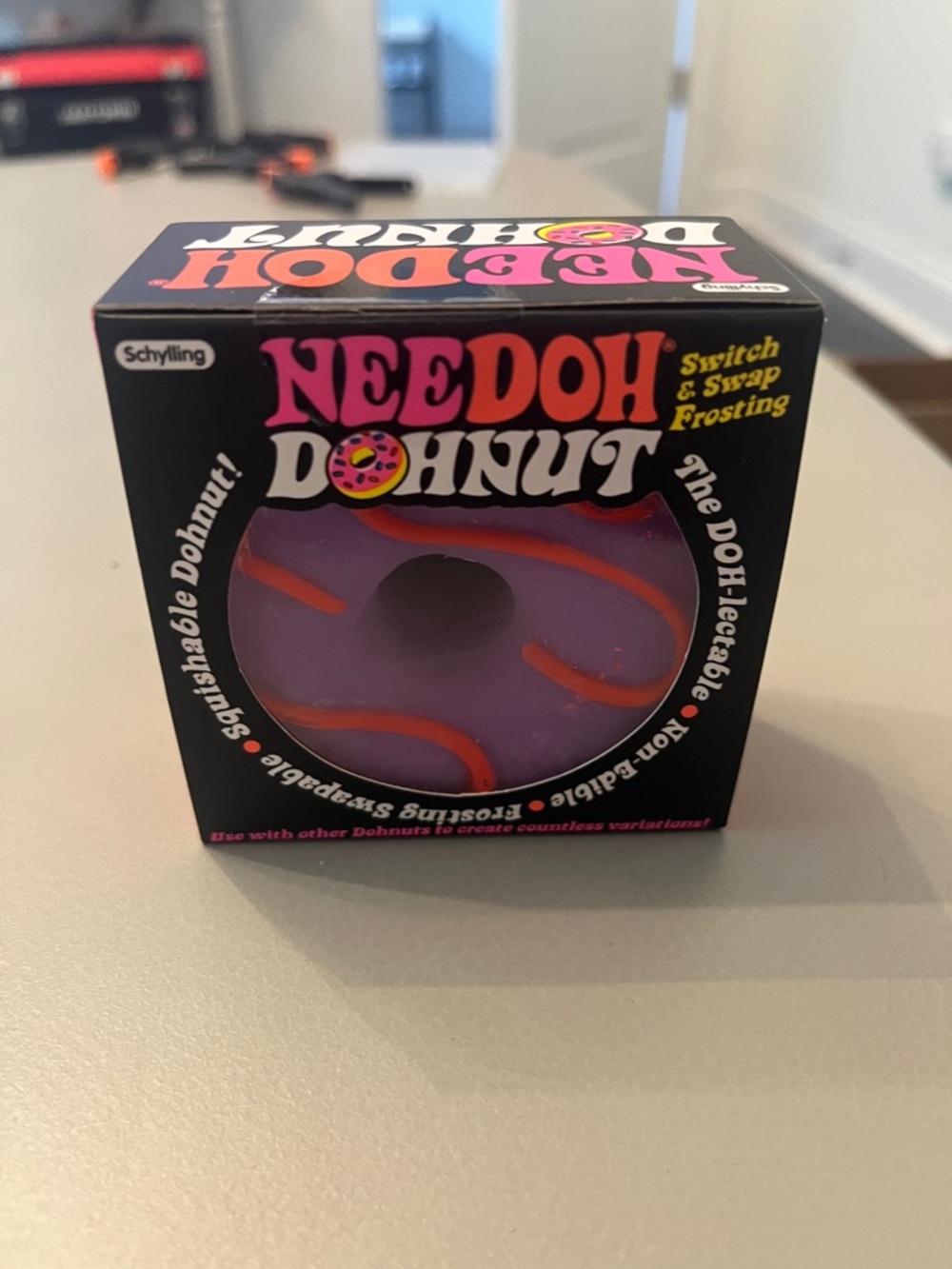 Needoh Donut Squishy Toy - Purple with Orange Frosting